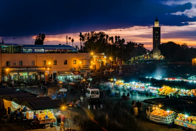 TukTuk Marrakech passing ornate archways